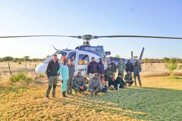 Wildlife Vet Course 2022 - Group shot with chopper at Etosha Heights PR, Namibia © GCF